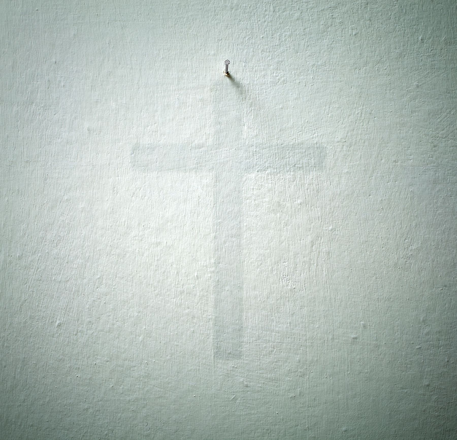 Crucifix. Old wall with the sign of a crucifix.